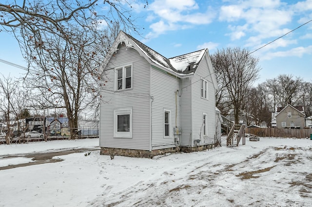 view of snow covered house