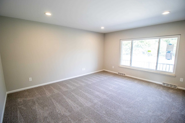 empty room featuring carpet floors