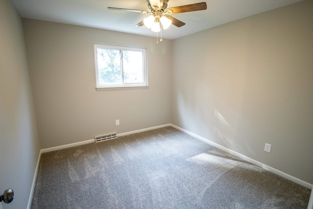 spare room with ceiling fan and carpet floors