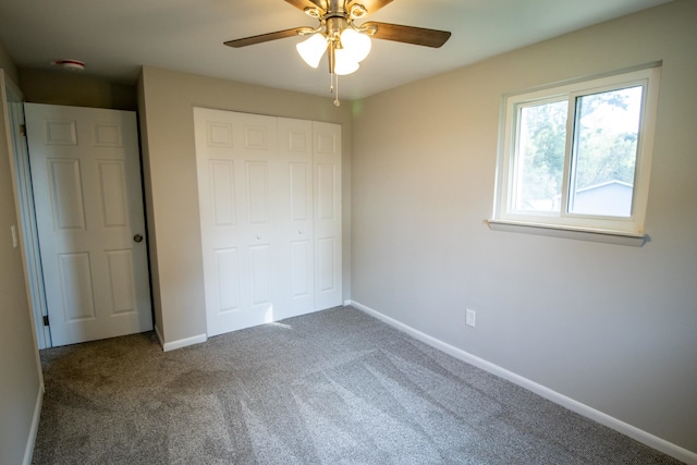 unfurnished bedroom featuring carpet flooring, ceiling fan, and a closet