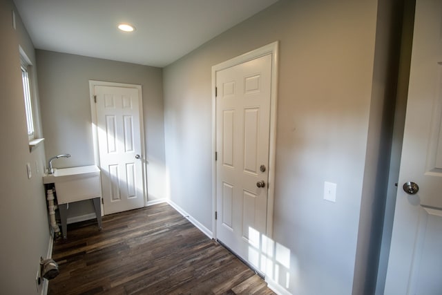 doorway featuring dark hardwood / wood-style floors