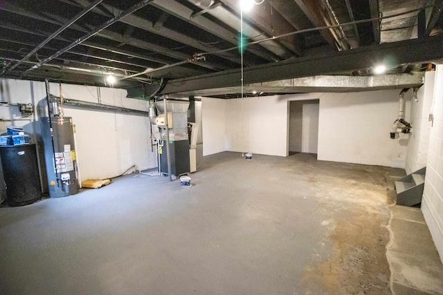 basement with gas water heater and heating unit