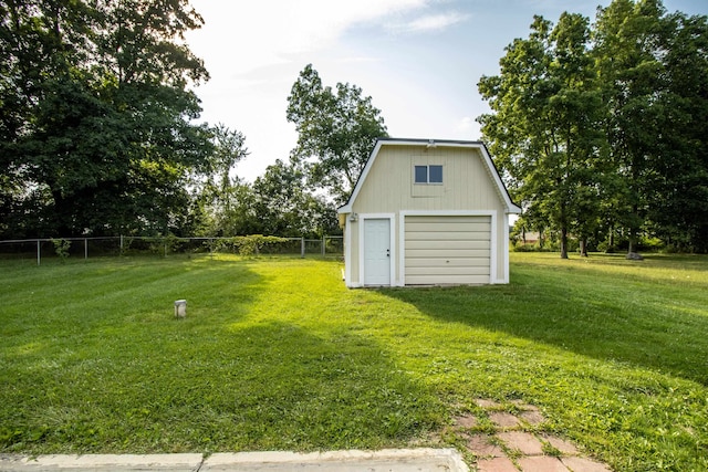 view of yard with a garage and an outdoor structure