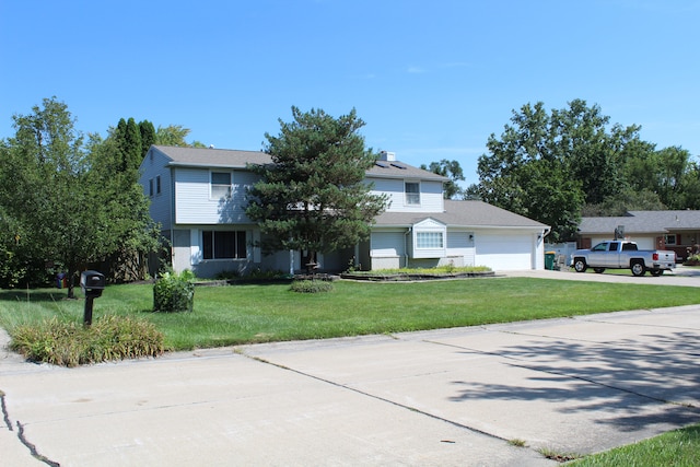 29352 Medburn Ct, Farmington Hills, MI 48336 - view of front facade featuring a garage, a front yard, and driveway