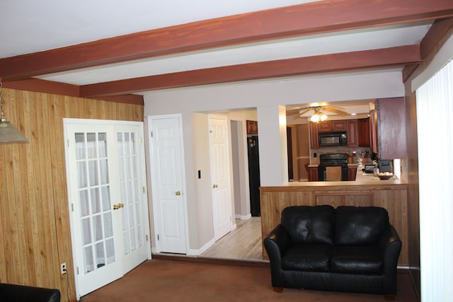 29352 Medburn Ct, Farmington Hills, MI 48336 - living area with wooden walls, baseboards, ceiling fan, beamed ceiling, and light carpet