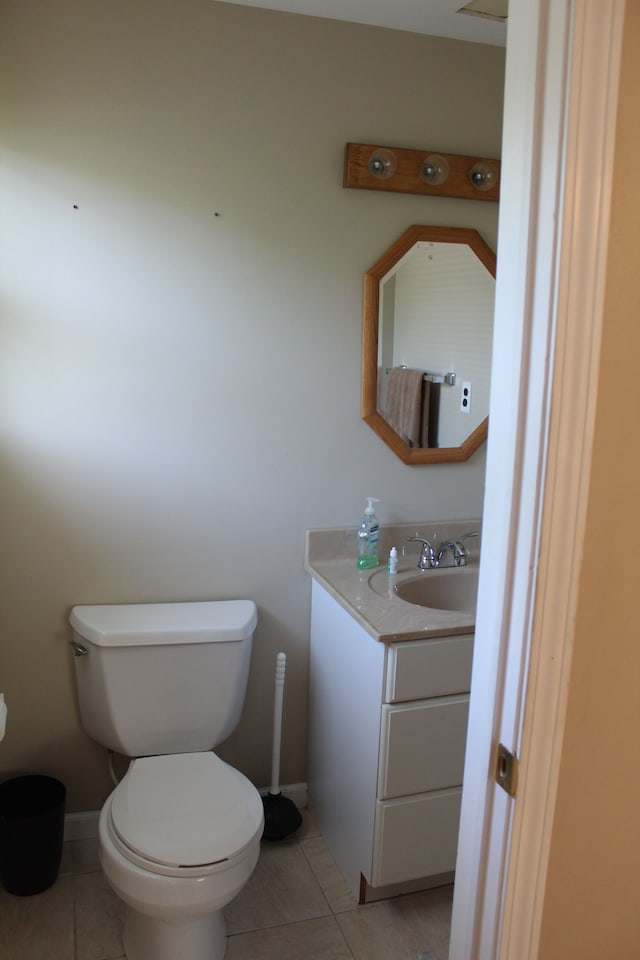 29352 Medburn Ct, Farmington Hills, MI 48336 - half bathroom with tile patterned floors, toilet, and vanity