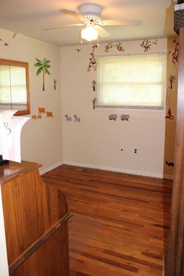 29352 Medburn Ct, Farmington Hills, MI 48336 - unfurnished room featuring baseboards, a ceiling fan, and wood finished floors