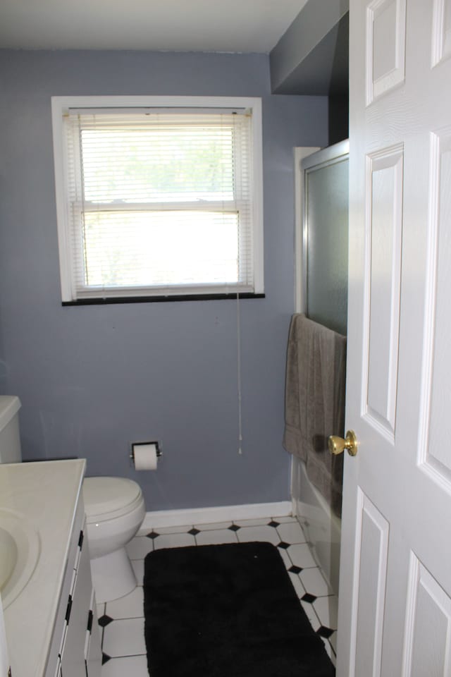29352 Medburn Ct, Farmington Hills, MI 48336 - full bathroom featuring a shower with door, baseboards, toilet, tile patterned floors, and vanity