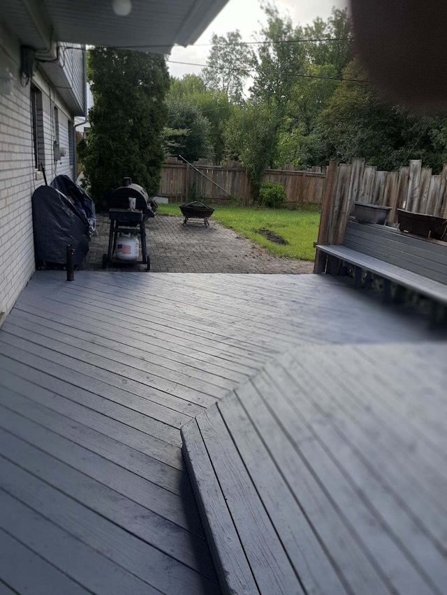 29352 Medburn Ct, Farmington Hills, MI 48336 - wooden deck with grilling area and a fenced backyard