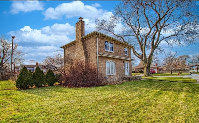 view of side of home featuring a lawn