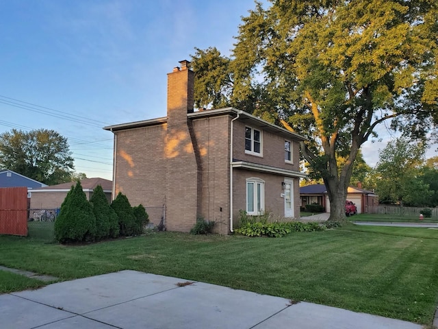 view of property exterior featuring a lawn