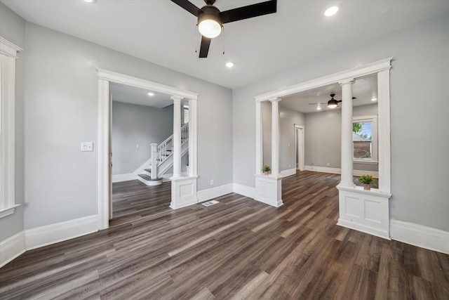 spare room featuring ceiling fan and dark hardwood / wood-style flooring