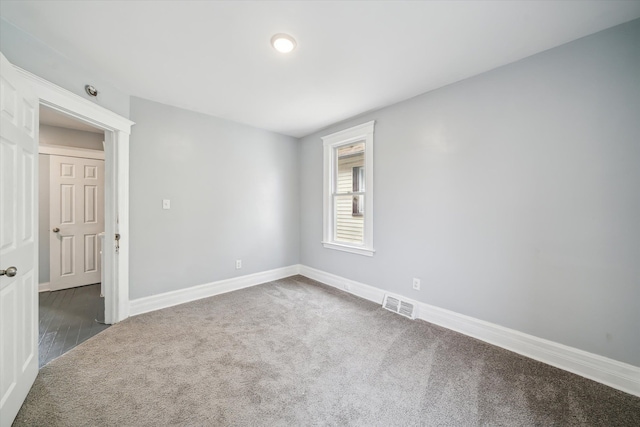 5775 Fischer St, Detroit, MI 48213 - carpeted empty room featuring baseboards