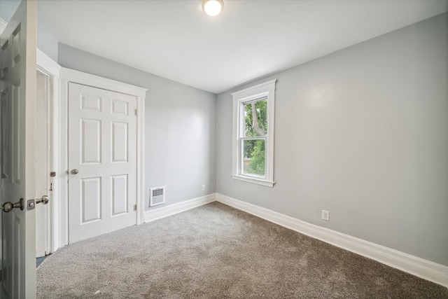 empty room with carpet flooring