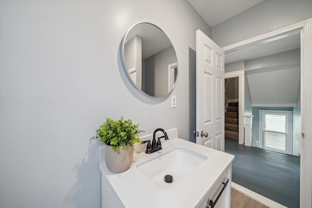 bathroom with vanity and wood-type flooring