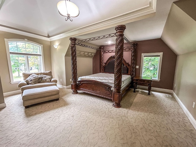 carpeted bedroom featuring vaulted ceiling and ornamental molding