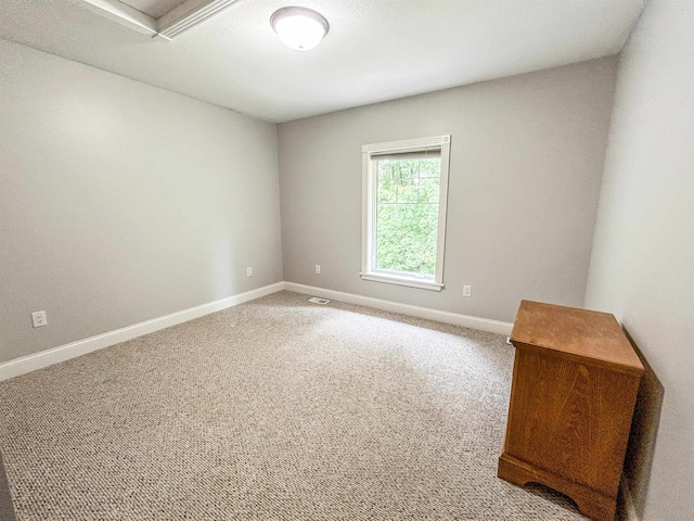 spare room with carpet floors