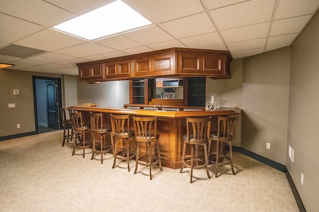 bar with a paneled ceiling