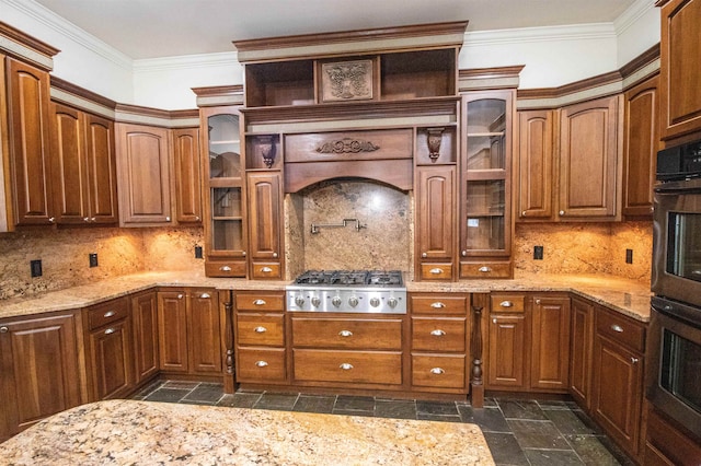 kitchen featuring appliances with stainless steel finishes, backsplash, light stone counters, and crown molding