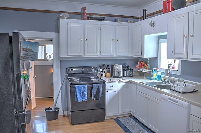 kitchen featuring dishwasher, white cabinets, light hardwood / wood-style floors, black range with electric stovetop, and fridge