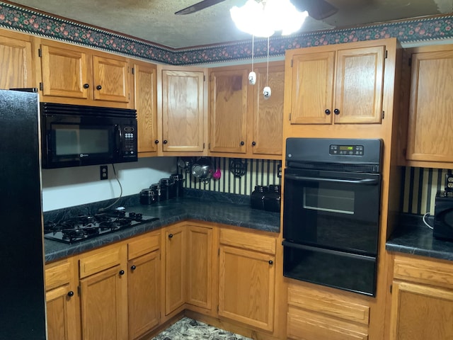 kitchen featuring ceiling fan and black appliances