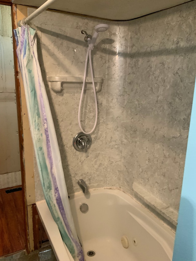 bathroom with shower / bath combination with curtain