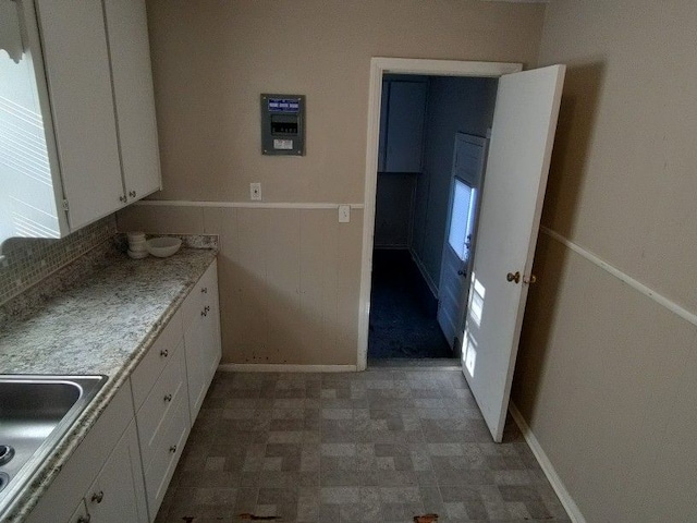 kitchen with white cabinets and sink