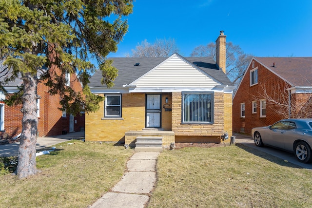 bungalow-style house featuring a front yard