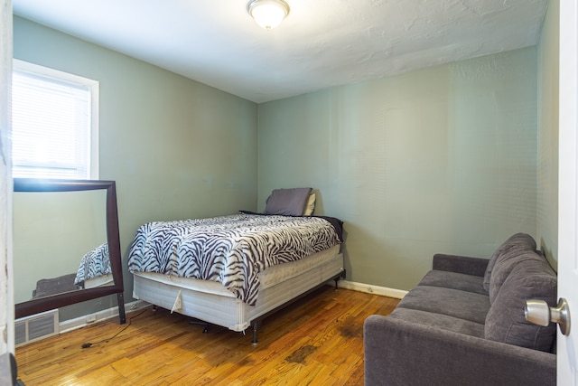 bedroom featuring hardwood / wood-style floors