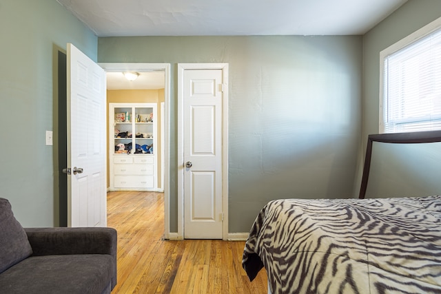 bedroom with wood-type flooring