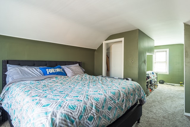 bedroom featuring carpet floors and vaulted ceiling