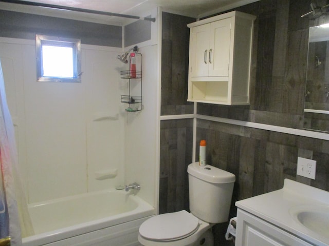 full bathroom featuring shower / bath combo, wood walls, toilet, and vanity