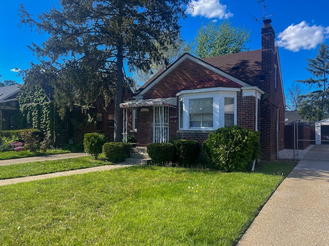 bungalow-style house with a front lawn