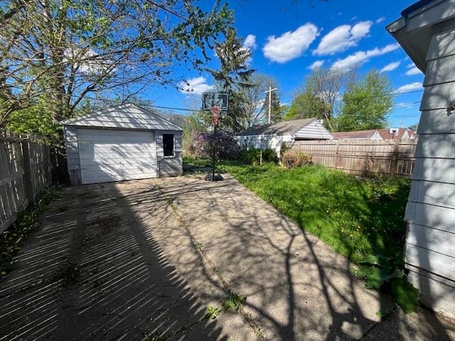 exterior space featuring an outbuilding and a garage