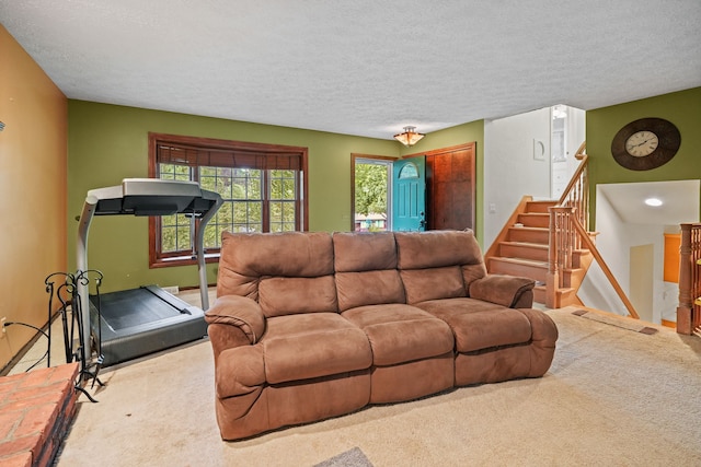 living room with carpet and a textured ceiling