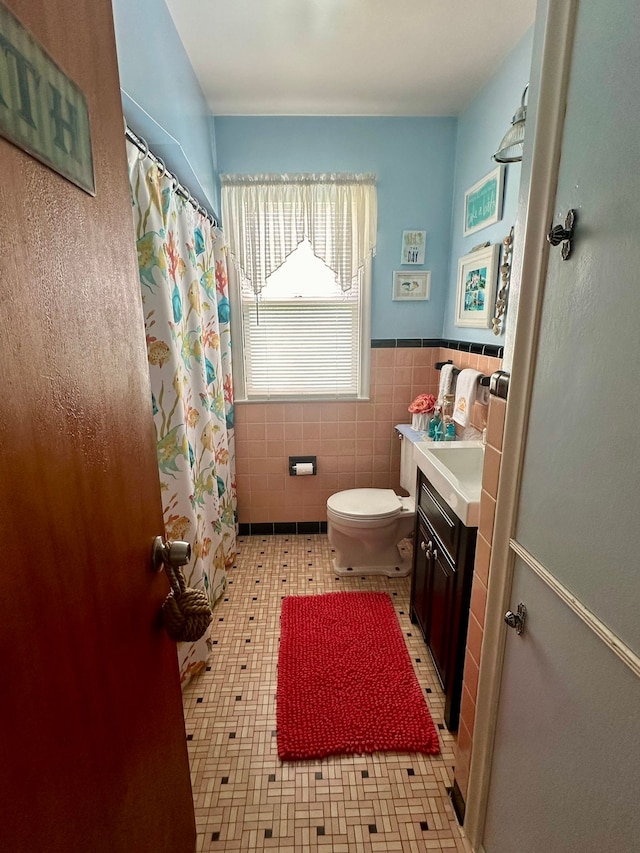 12841 Telegraph Rd, Taylor, MI 48180 - bathroom featuring vanity, tile walls, a shower with curtain, and a wainscoted wall
