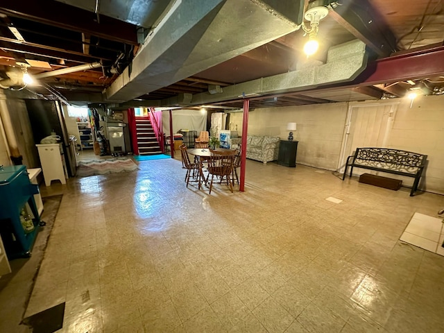 12841 Telegraph Rd, Taylor, MI 48180 - basement featuring tile patterned floors, stairway, and heating unit