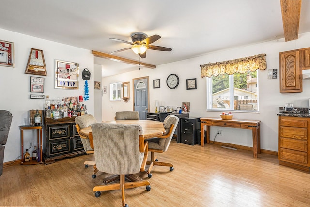 dining space featuring beam ceiling, ceiling fan, and light hardwood / wood-style flooring