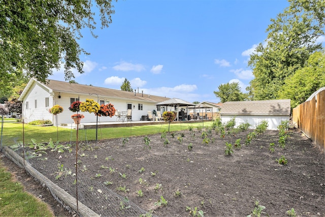 exterior space with a gazebo and a yard