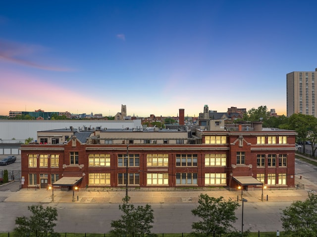 view of back house at dusk