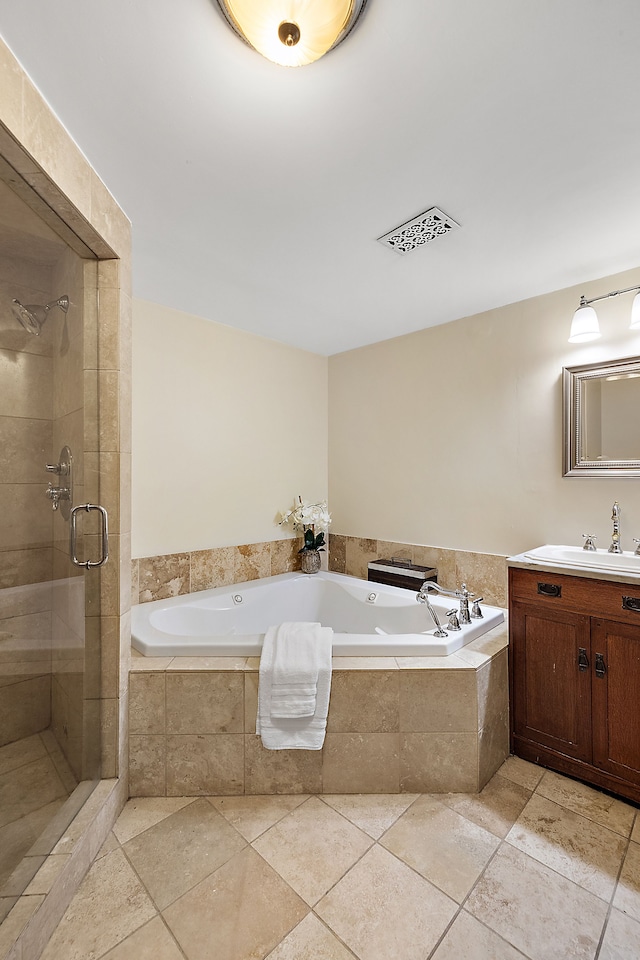 bathroom featuring tile patterned floors, vanity, and independent shower and bath