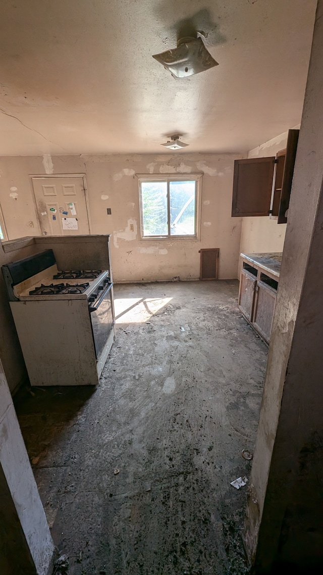 14025 Dacosta St, Detroit, MI 48223 - kitchen with white range with gas cooktop and ceiling fan
