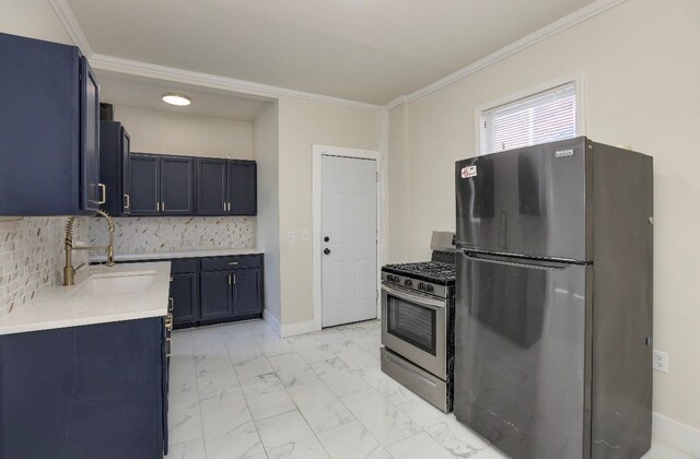 kitchen with refrigerator, crown molding, sink, and stainless steel gas range