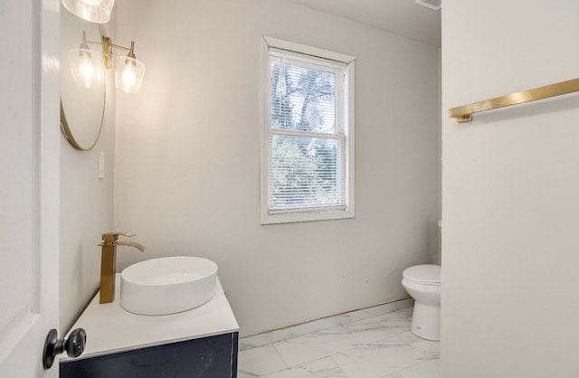 bathroom with vanity and toilet