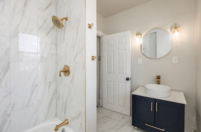 bathroom featuring vanity and tiled shower / bath combo