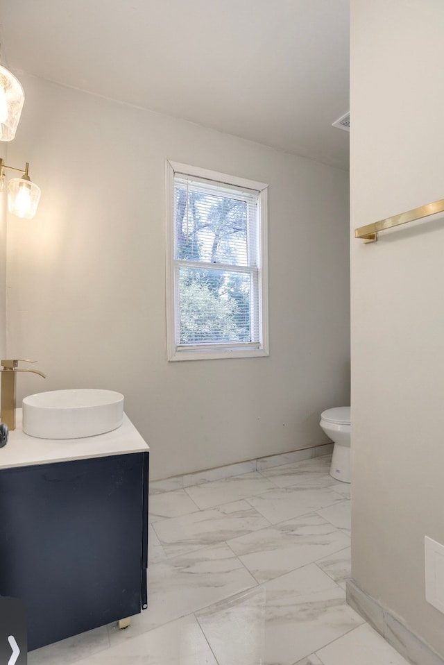 bathroom with vanity and toilet