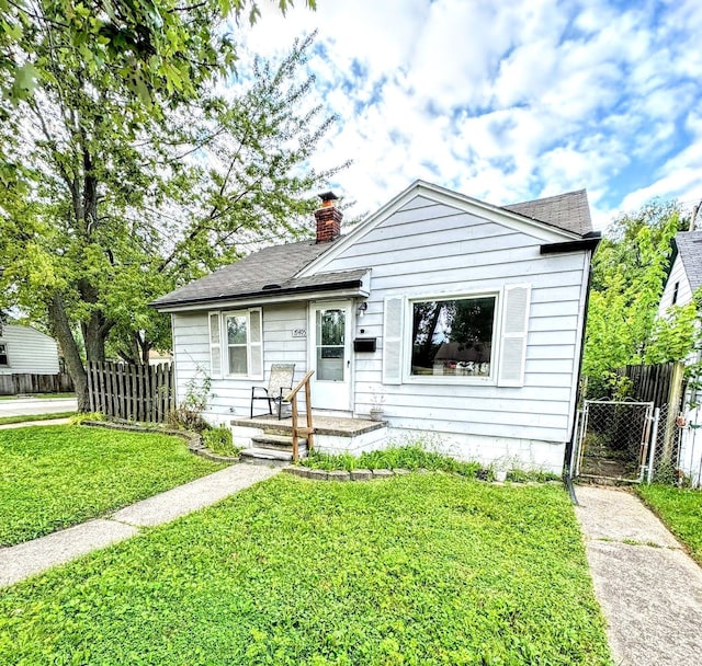 bungalow with a front yard