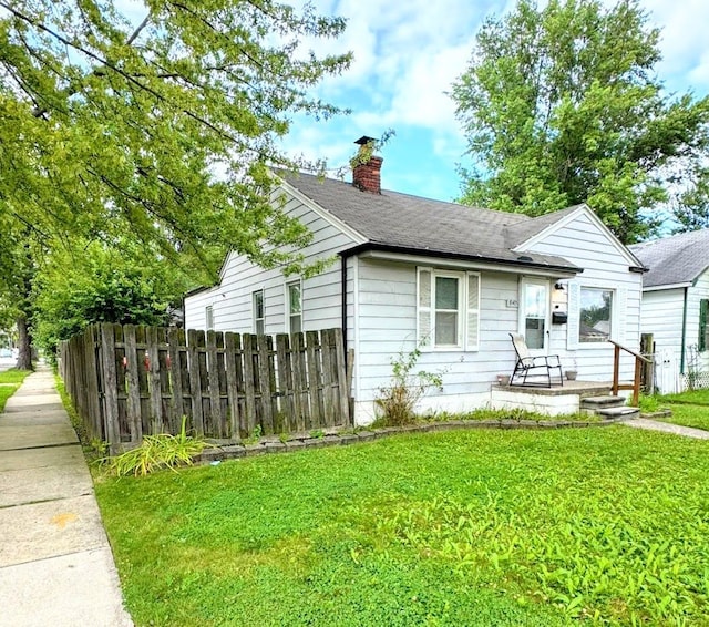 view of front of property with a front lawn