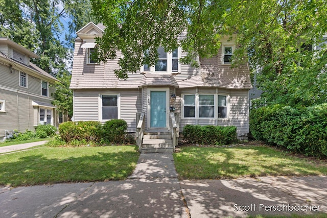 view of front of property with a front lawn