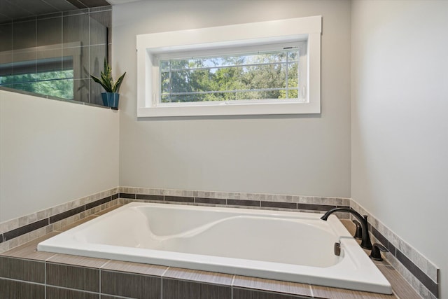 bathroom with tiled bath